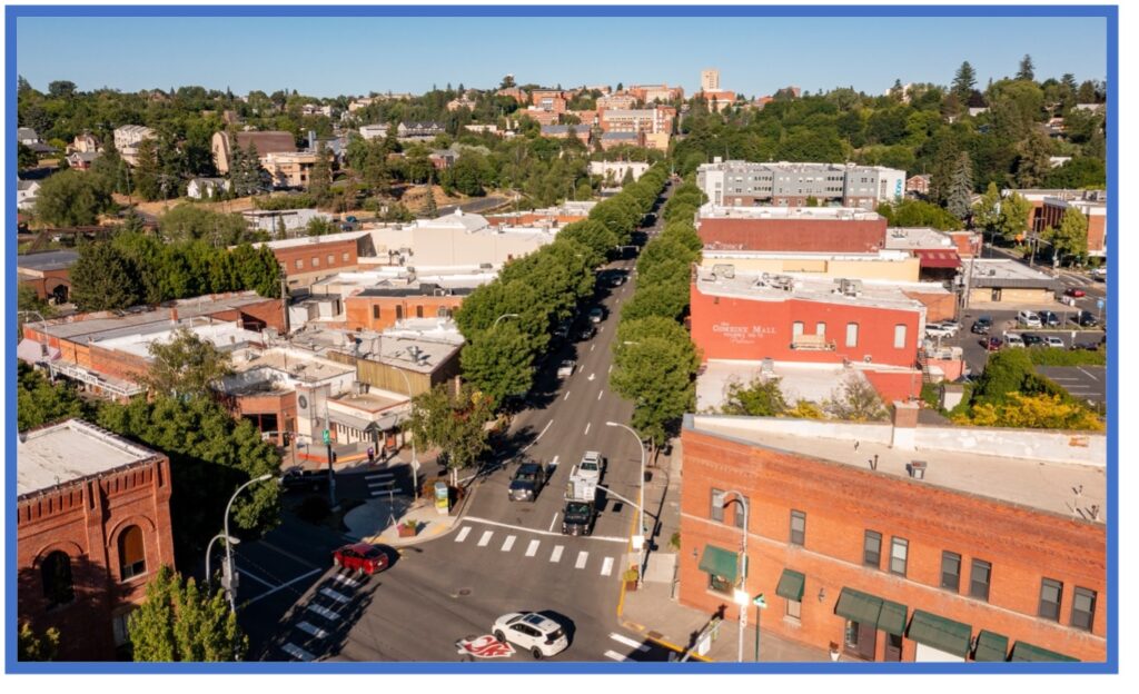 Aerial photograph of downtown Pullman Washington with Washington State University in the background.